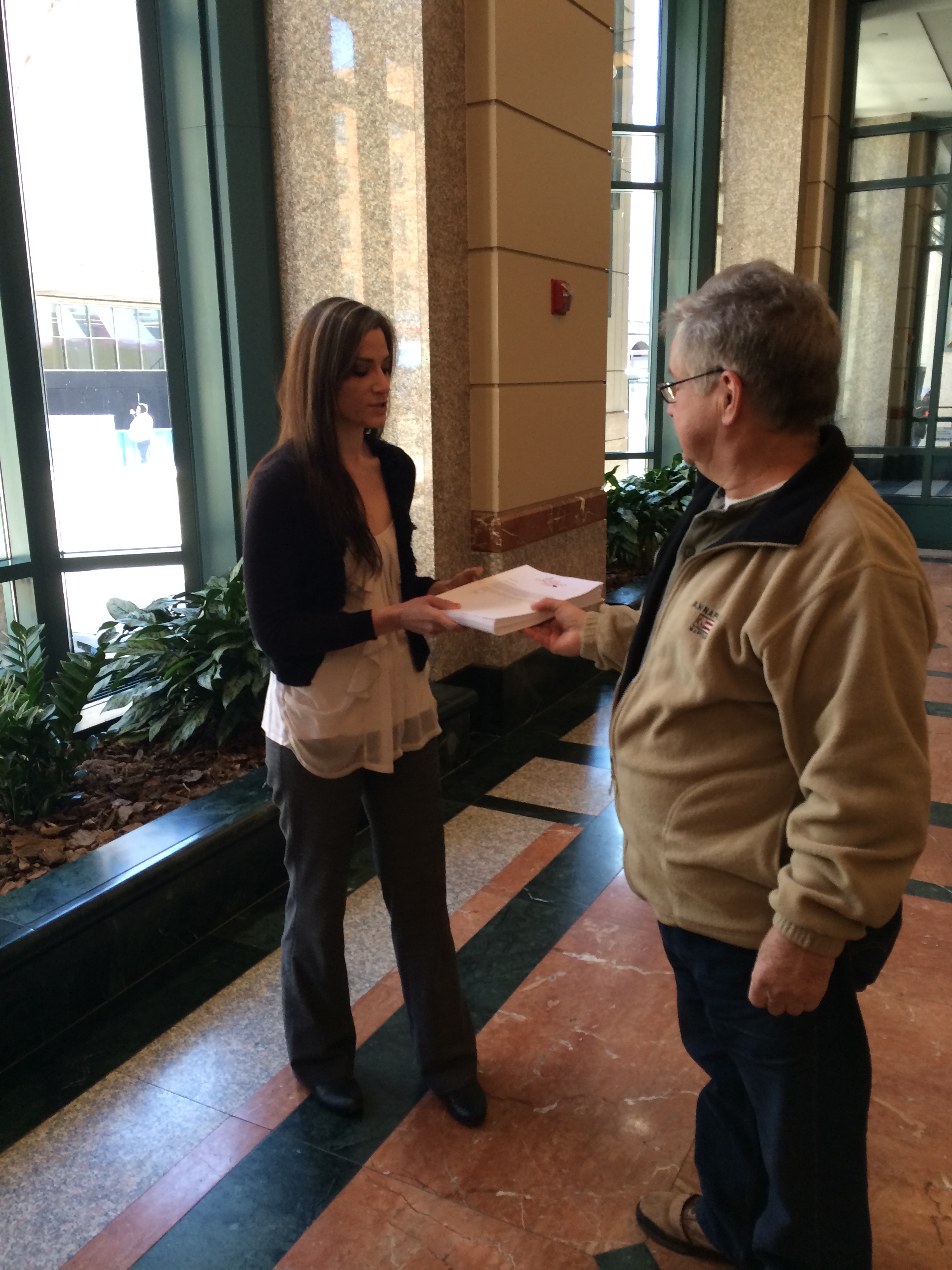 Jan Nethen, Support Conowingo Dam volunteer (right), delivers petition signatures to Sarah Gross, Public Affairs Specialist for the U.S. Army Corps of Engineers (left). 